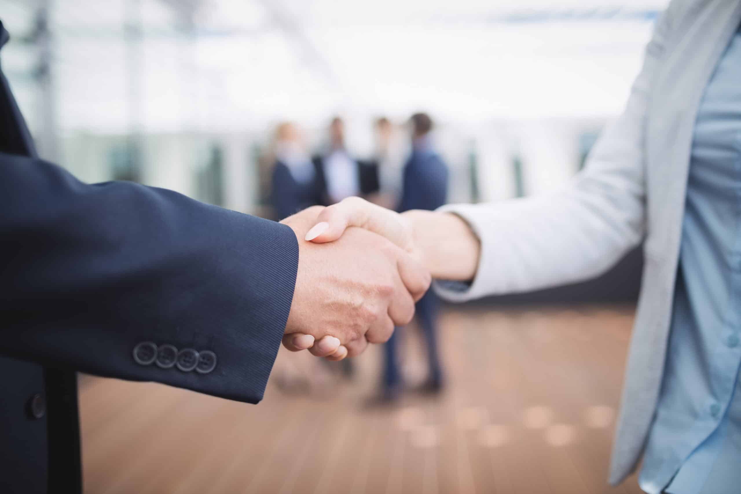 Law Firm Marketing - Close-up of lawyers shaking hands